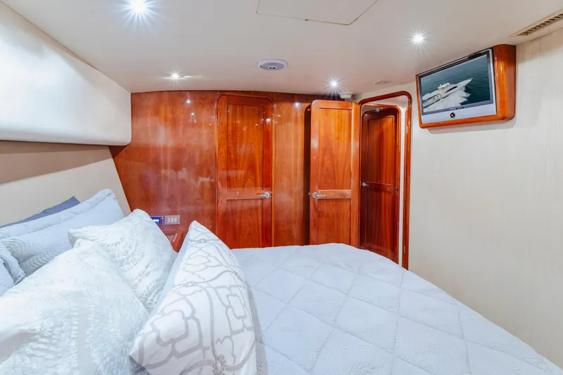 Slide: The Image of Luxurious bedroom interior of 2008 Ocean Yachts 54 Super Sport with wood paneling and TV. - 35