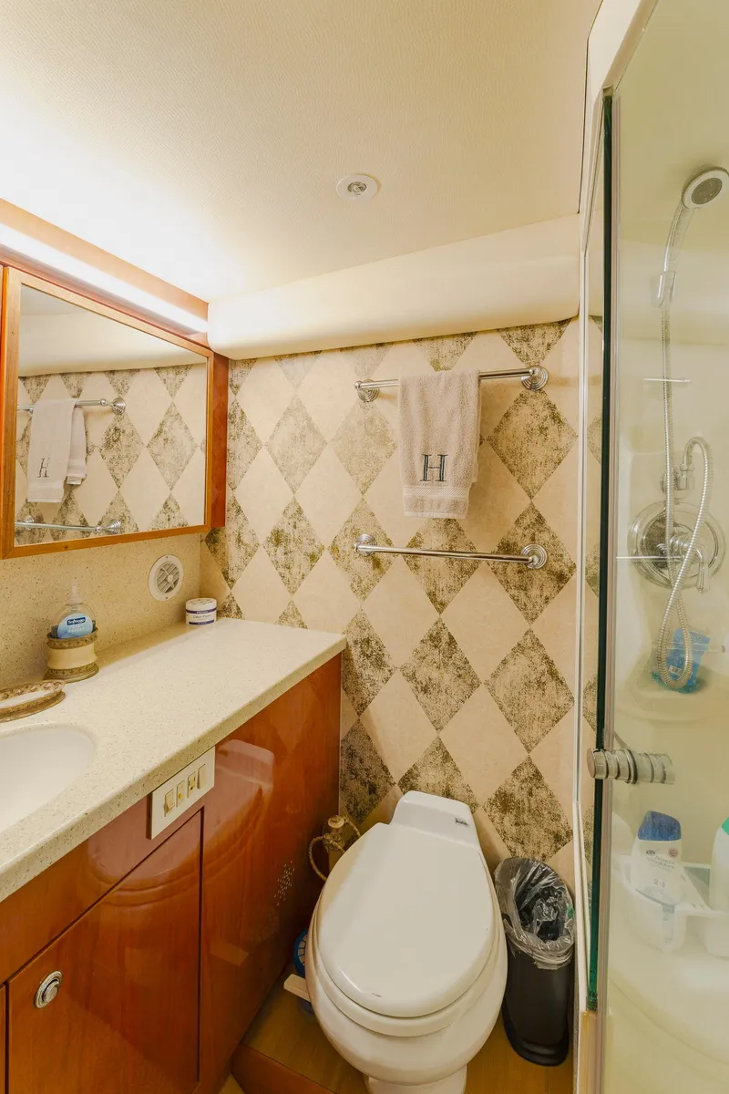 Slide: The Image of Luxurious bathroom in 2008 Ocean Yachts 54 Super Sport with elegant fixtures and shower. - 36