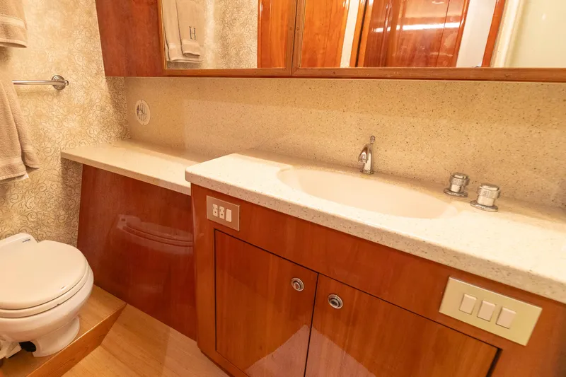 Slide: The Image of Luxurious bathroom in 2008 Ocean Yachts 54 Super Sport, featuring elegant wood cabinetry and modern fixtures. - 37