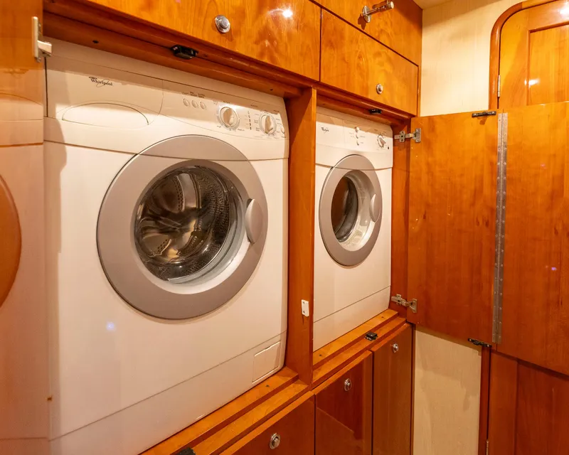 Slide: The Image of Laundry area with washer and dryer on 2008 Ocean Yachts 54 Super Sport. - 38