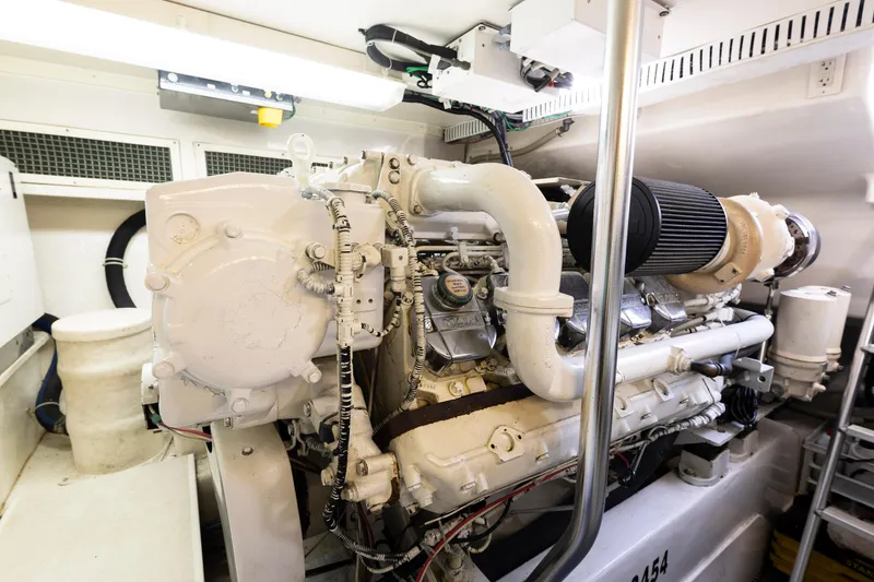 Slide: The Image of Engine room of 2008 Ocean Yachts 54 Super Sport, showcasing powerful marine engine components. - 43