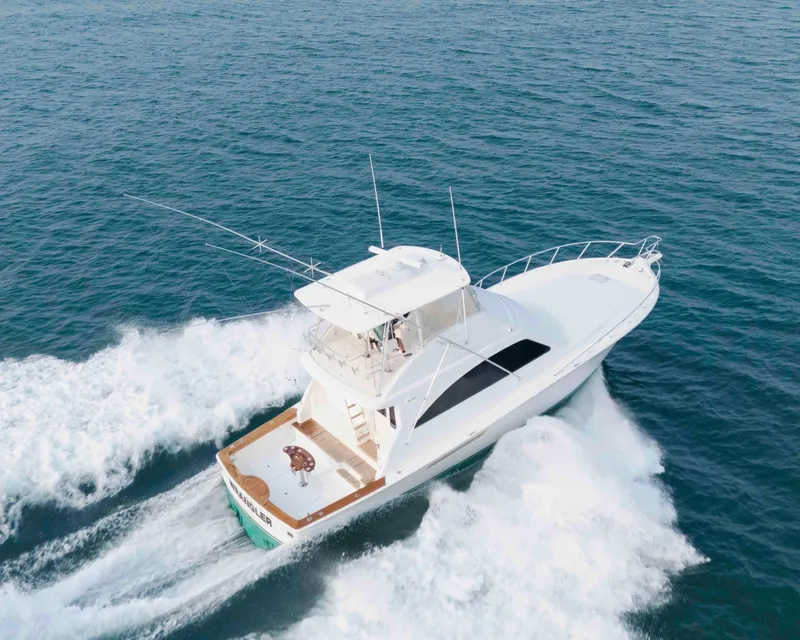 Slide: The Image of Ocean Yachts 54 Super Sport 2008 cruising on open water, aerial view. - 6