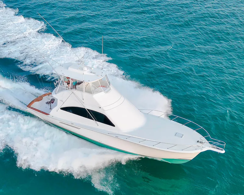 Slide: The Image of Ocean Yachts 54 Super Sport 2008 cruising on turquoise waters, aerial view. - 8