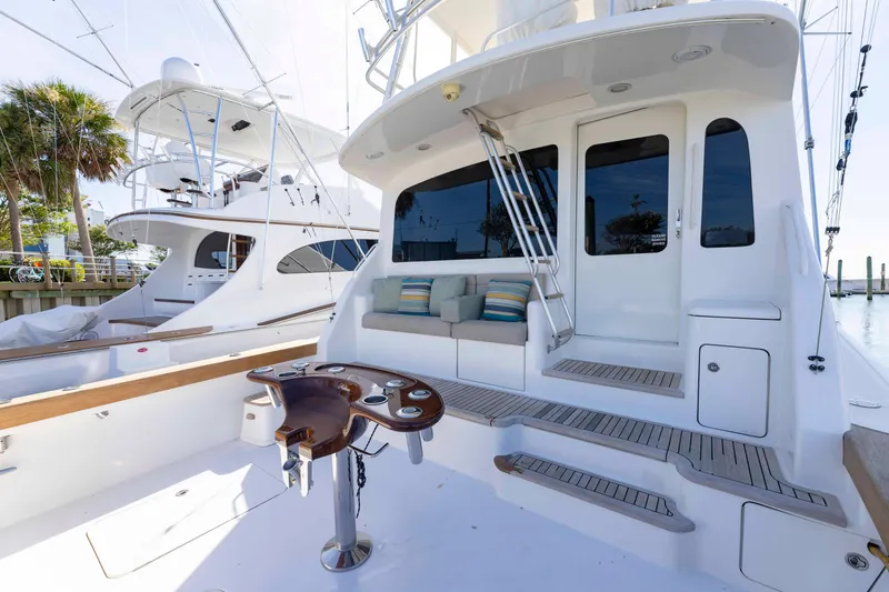 Slide: The Image of 2008 Ocean Yachts 54 Super Sport, featuring a spacious deck with seating and fishing amenities. - 9