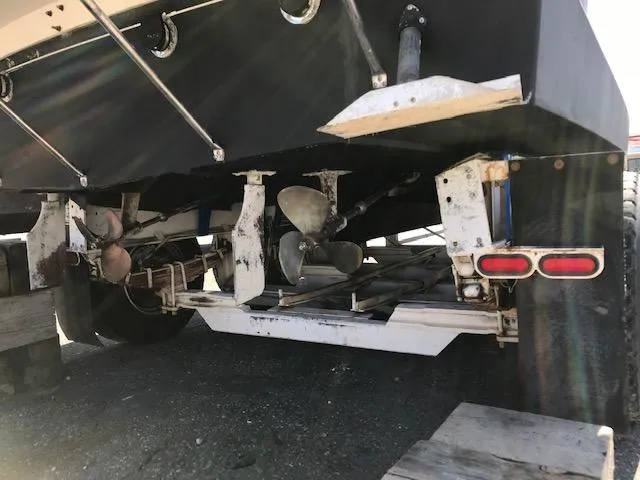 Slide: The Image of 1986 Carver Mariner 32x14.3 boat underside showing propellers and rudders. - 10