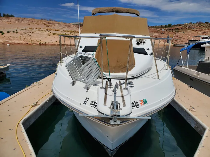 Slide: The Image of 1986 Carver Mariner 32x14.3 boat docked in a serene marina setting. - 19