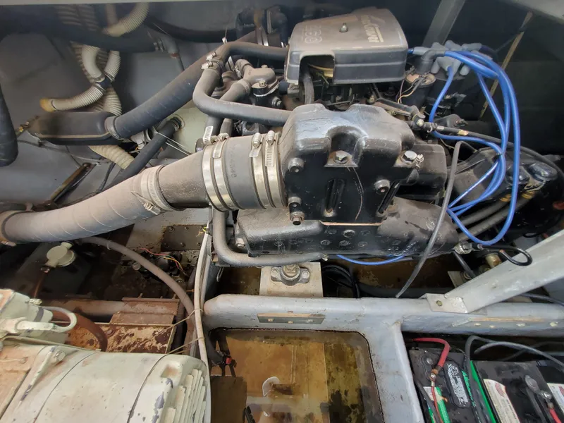 Slide: The Image of Engine compartment of a 1986 Carver Mariner 32x14.3 boat, showing mechanical components. - 34
