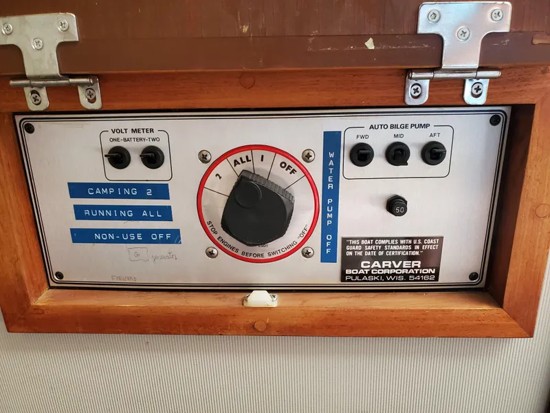 Slide: The Image of Control panel of a 1986 Carver Mariner 32x14.3 boat with switches and volt meter. - 47