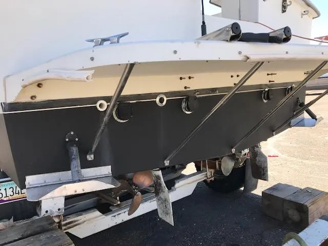 Slide: The Image of 1986 Carver Mariner 32x14.3 boat stern view with propeller and rudder details. - 8