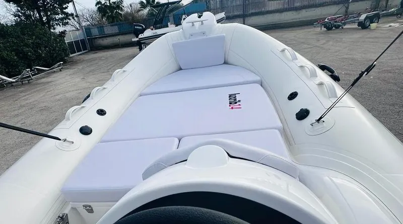 Slide: The Image of 2024 Aqvaboats LUXRIB 14 inflatable boat with white cushioned seating. - 5