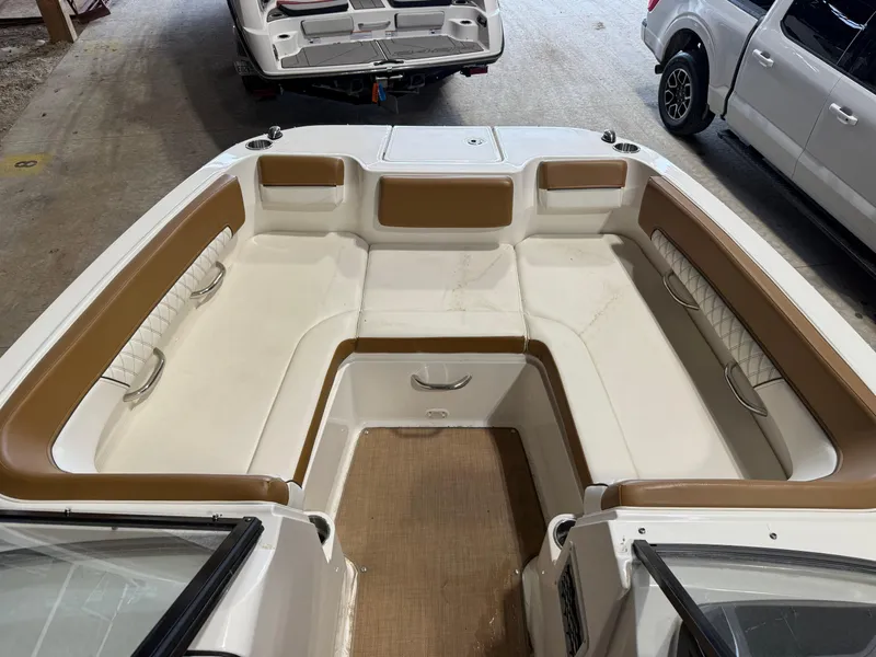 Slide: The Image of 2021 Bayliner DX 2250 boat interior with spacious seating and modern design. - 8