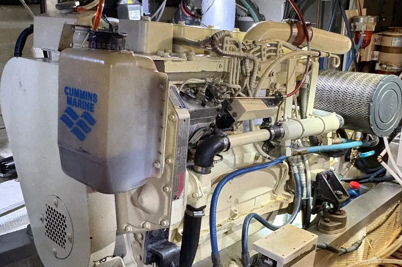 Slide: The Image of Engine room of a 1990 Grand Banks Classic boat with Cummins Marine engine. - 18