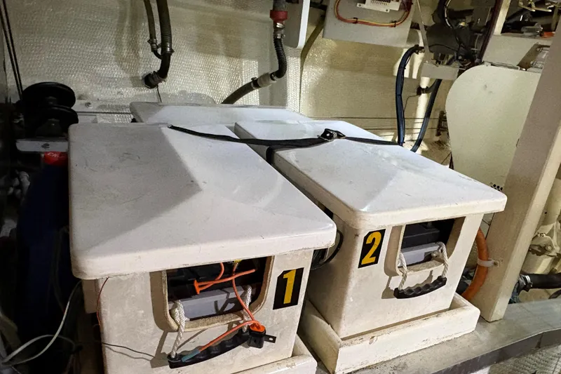 Slide: The Image of Battery compartments in a 1990 Grand Banks Classic yacht engine room. - 23