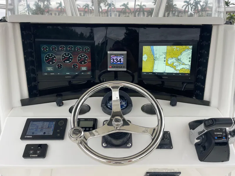 Slide: The Image of Boat dashboard with navigation screens and controls, Venture 34 Tournament, 2000 model. - 18