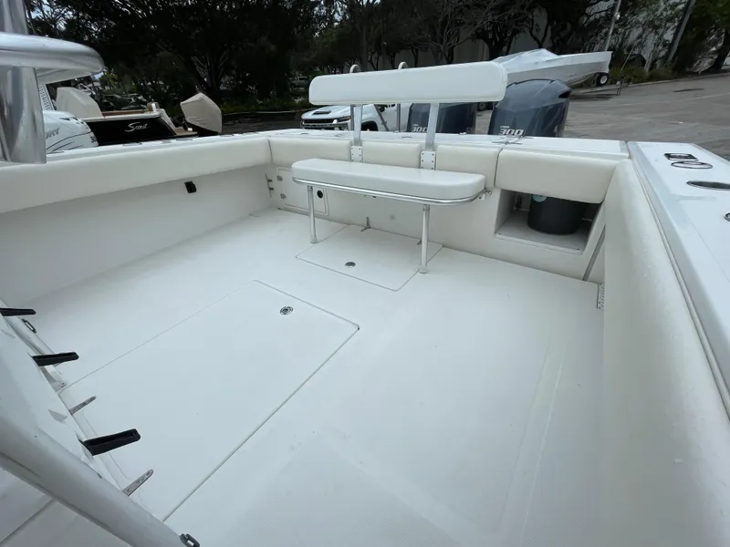 Slide: The Image of 2000 Venture 34 Tournament boat interior with seating and storage. - 21