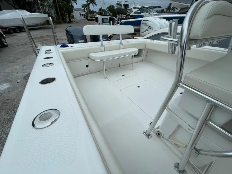 Slide: The Image of 2000 Venture 34 Tournament boat deck with seating and rod holders. - 31