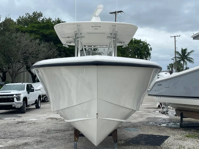 Slide: The Image of 2000 Venture 34 Tournament boat, front view, parked outdoors. - 4