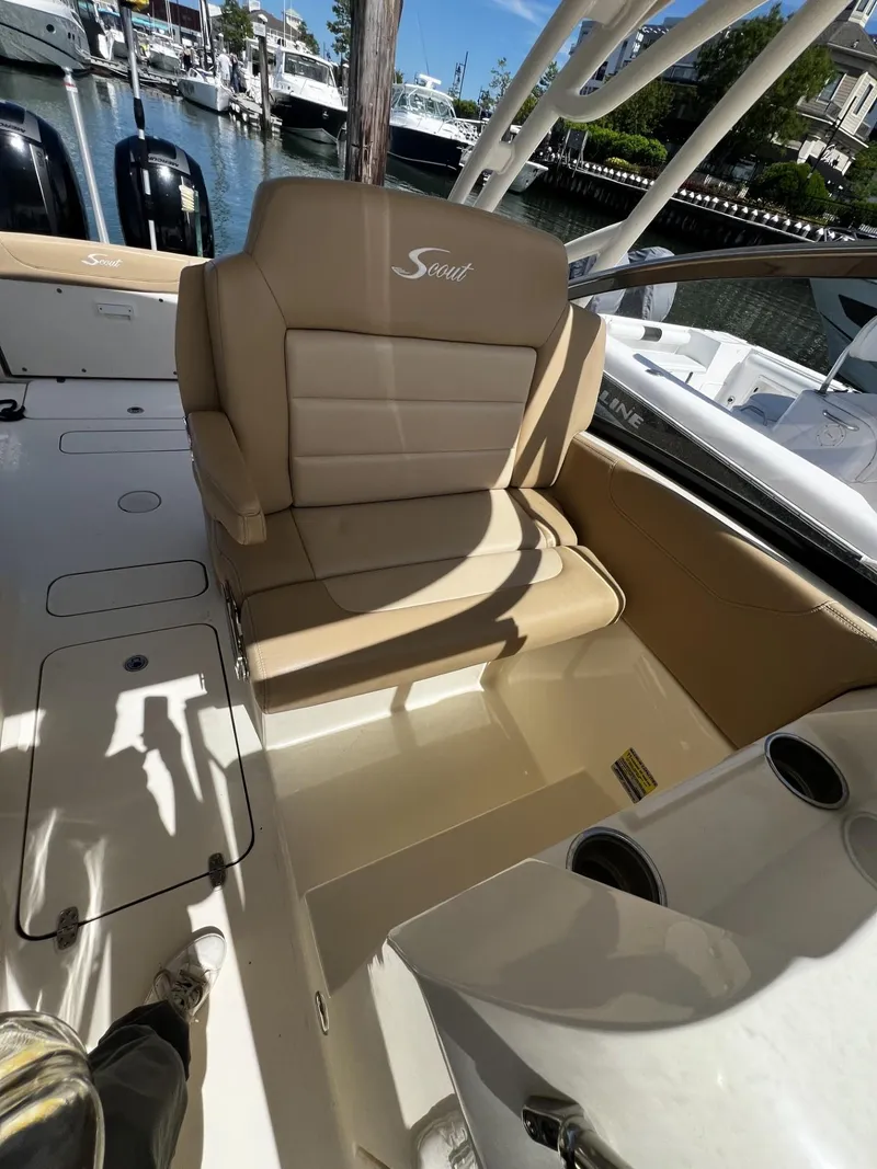 Slide: The Image of 2019 Scout 255 Dorado boat interior with tan seating and cup holders. - 9
