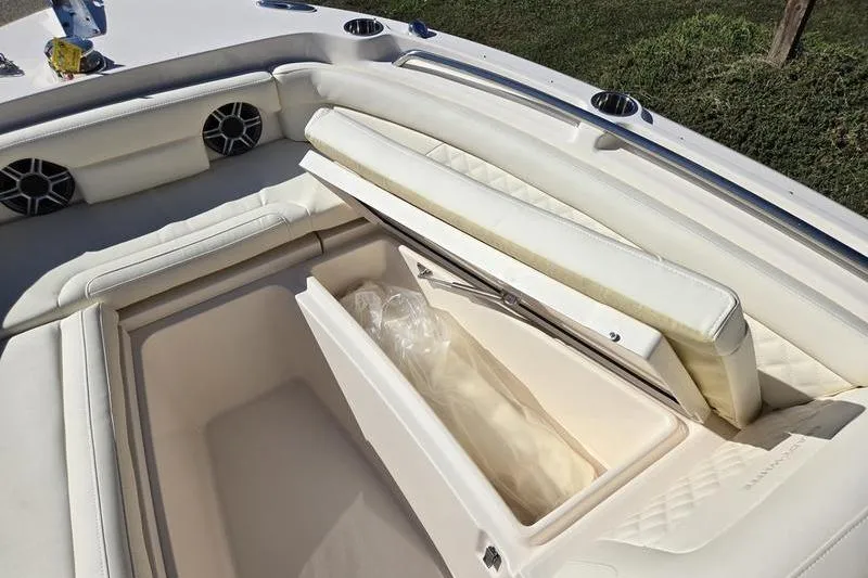 Slide: The Image of 2026 Grady-White Freedom 235 boat interior under sunny blue sky. - 28