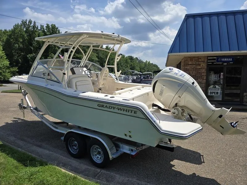 Slide: The Image of Close-up of Grady-White Freedom 235 engine, showcasing 350 V6 4.3L specifications. - 3