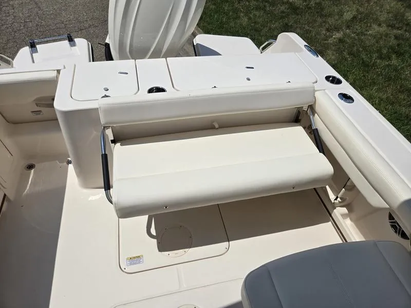 Slide: The Image of 2026 Grady-White Freedom 235 boat on trailer with Yamaha engine, parked on grass. - 5