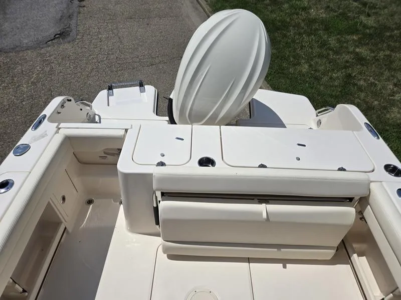 Slide: The Image of 2026 Grady-White Freedom 235 boat interior storage compartment with open hatch. - 7