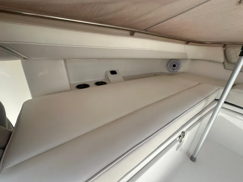 Slide: The Image of 2024 World Cat 280ccx interior cabin with cushioned seating and speaker system. - 14