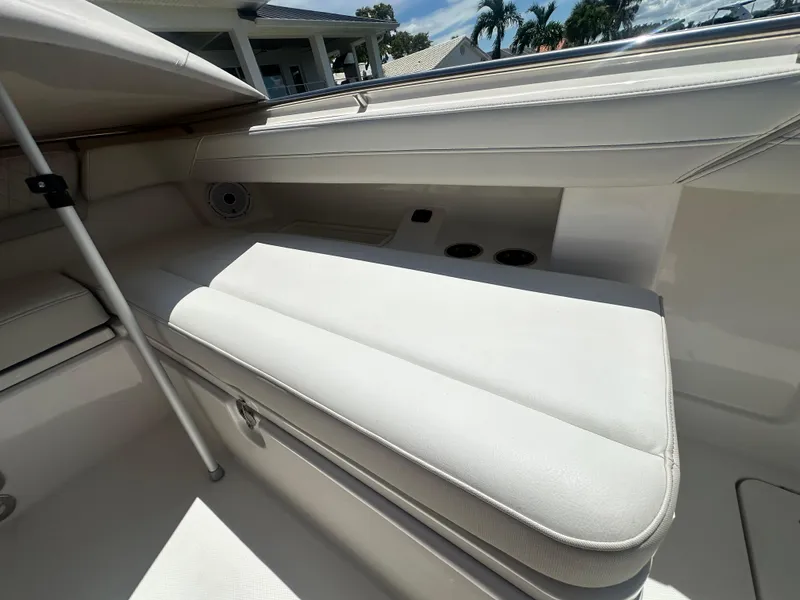 Slide: The Image of 2024 World Cat 280ccx boat interior with cushioned seating and cup holders. - 15