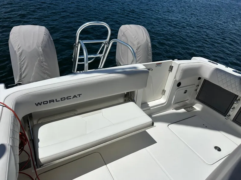 Slide: The Image of 2024 World Cat 280ccx boat interior with seating and ocean view. - 18