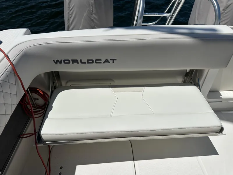 Slide: The Image of 2024 World Cat 280ccx boat seat with logo, featuring white upholstery and sleek design. - 19