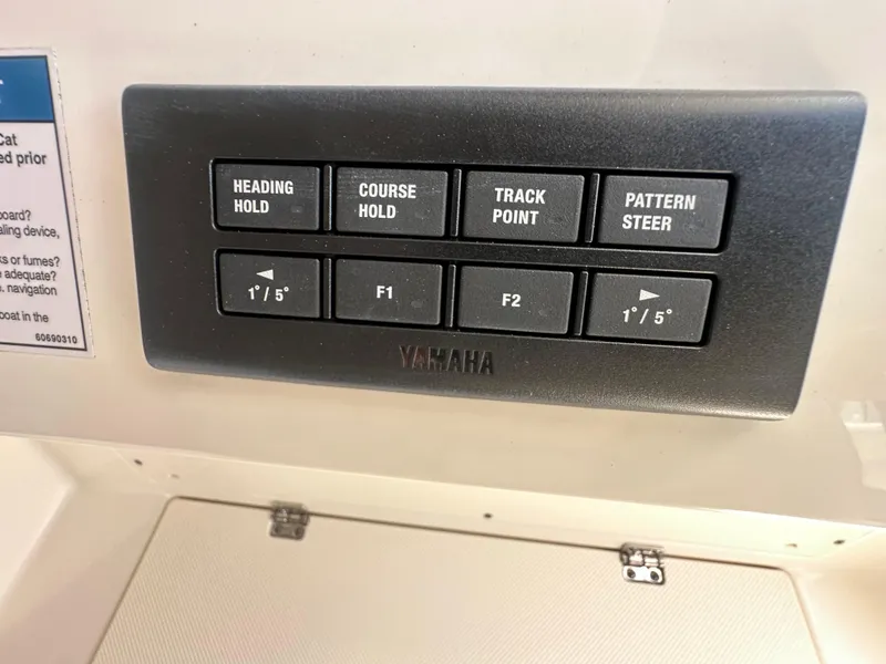 Slide: The Image of Control panel on 2024 World Cat 280ccx boat featuring Yamaha navigation buttons. - 22