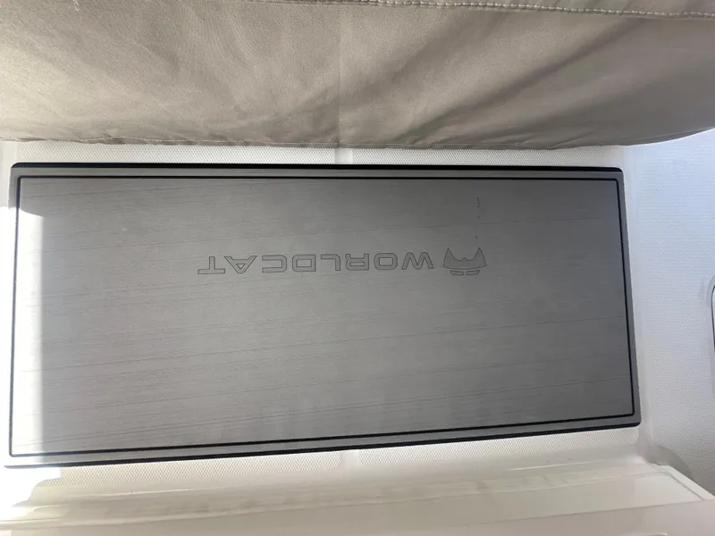 Slide: The Image of 2024 World Cat 280ccx boat interior with branded panel. - 23