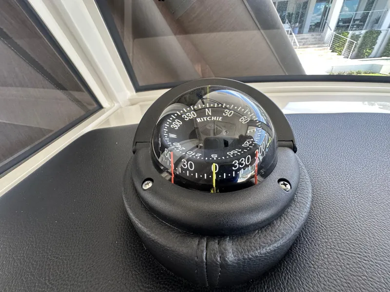 Slide: The Image of Compass on 2024 World Cat 280ccx boat dashboard, displaying navigation directions. - 24