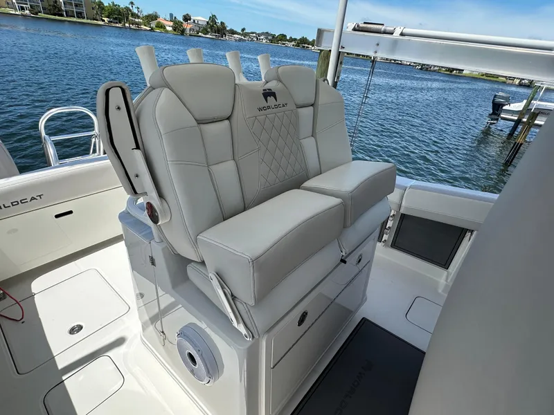 Slide: The Image of 2024 World Cat 280ccx boat interior with luxurious seating and waterfront view. - 30