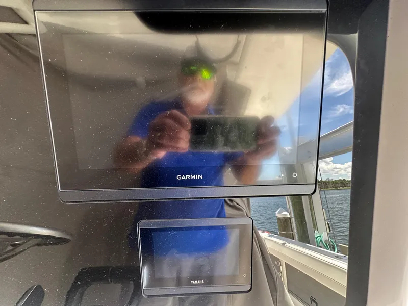 Slide: The Image of Reflection on Garmin and Yamaha screens aboard 2024 World Cat 280ccx boat. - 34
