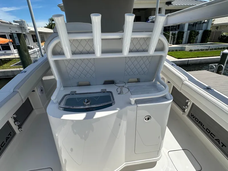 Slide: The Image of 2024 World Cat 280ccx boat interior with rod holders and storage compartments. - 43
