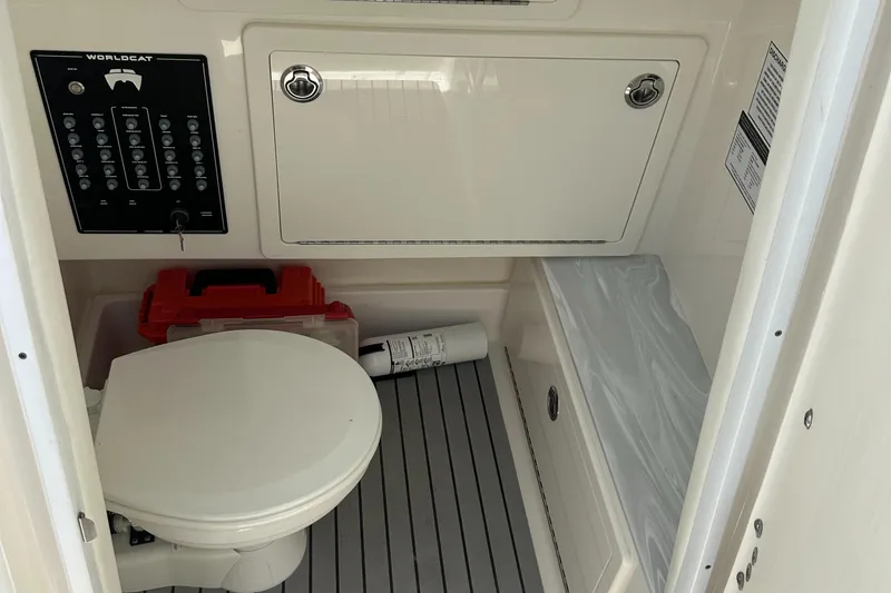 Slide: The Image of 2024 World Cat 280ccx boat interior with toilet and control panel. - 45