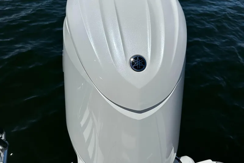 Slide: The Image of 2024 World Cat 280ccx boat engine detail on water. - 49