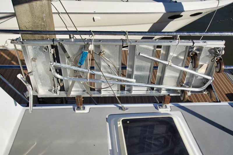Slide: The Image of Aluminum gangway on a 2001 Monk 36 (Hull #215) yacht, docked with visible railing. - 15
