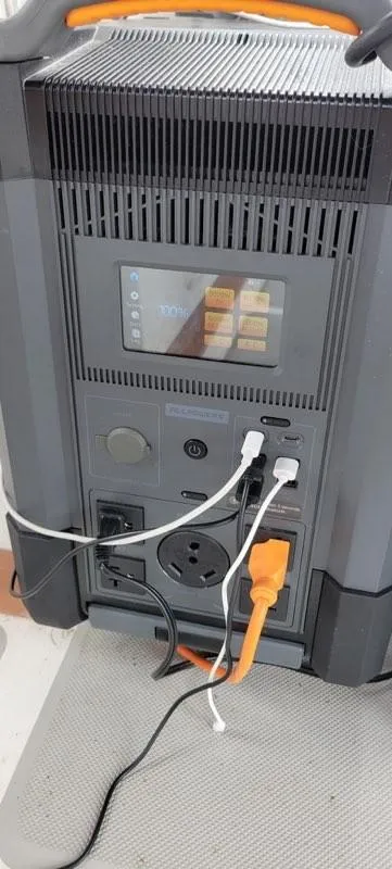 Slide: The Image of Portable power station with multiple charging ports and digital display, connected to various devices. - 22