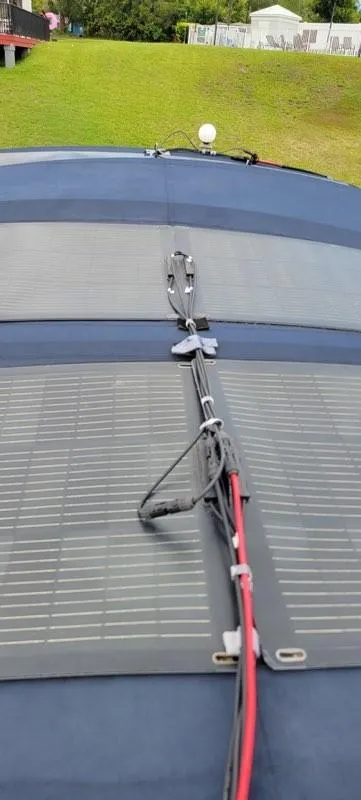 Slide: The Image of Solar panels on Monk 36 boat, Hull #215, 2001 model, with visible wiring. - 24