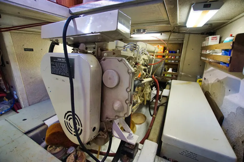 Slide: The Image of Engine room of 2001 Monk 36 (Hull #215) with generator and storage shelves. - 39