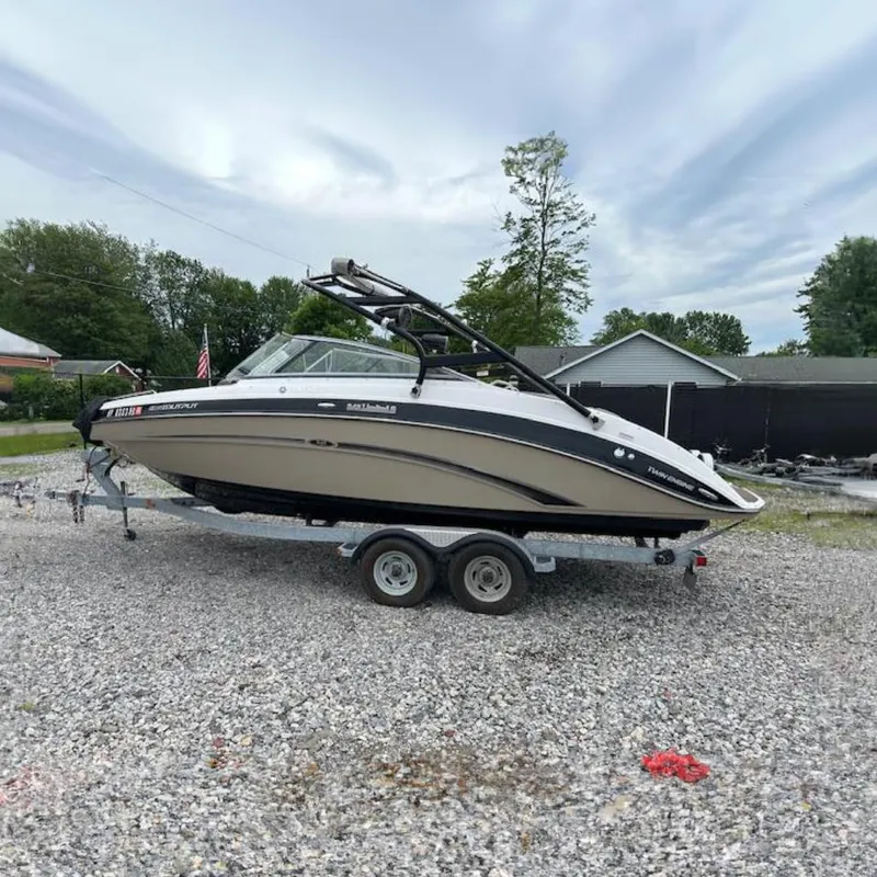 The Image of 2013 Yamaha Boats 242 Limited S on trailer, parked outdoors on gravel. - 0