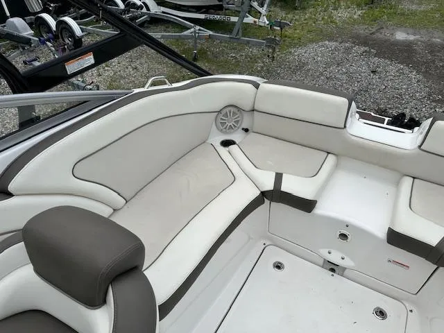 Slide: The Image of 2013 Yamaha Boats 242 Limited S interior seating with white and gray upholstery. - 8