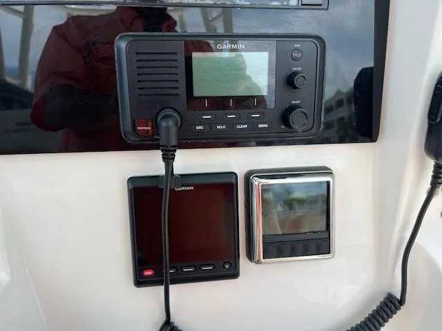 Slide: The Image of Garmin marine electronics on 2019 Cobia 320 Center Console boat dashboard. - 11