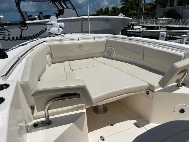Slide: The Image of 2019 Cobia 320 Center Console boat with spacious seating area and modern design. - 21