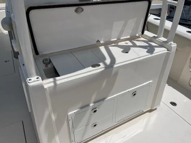 Slide: The Image of 2019 Cobia 320 Center Console boat interior with storage compartments. - 24