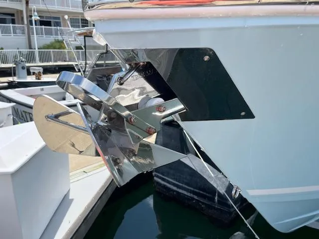 Slide: The Image of 2019 Cobia 320 Center Console boat anchor detail at marina. - 29