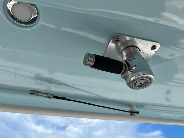 Slide: The Image of 2019 Cobia 320 Center Console boat detail with mounted fishing rod holder. - 8