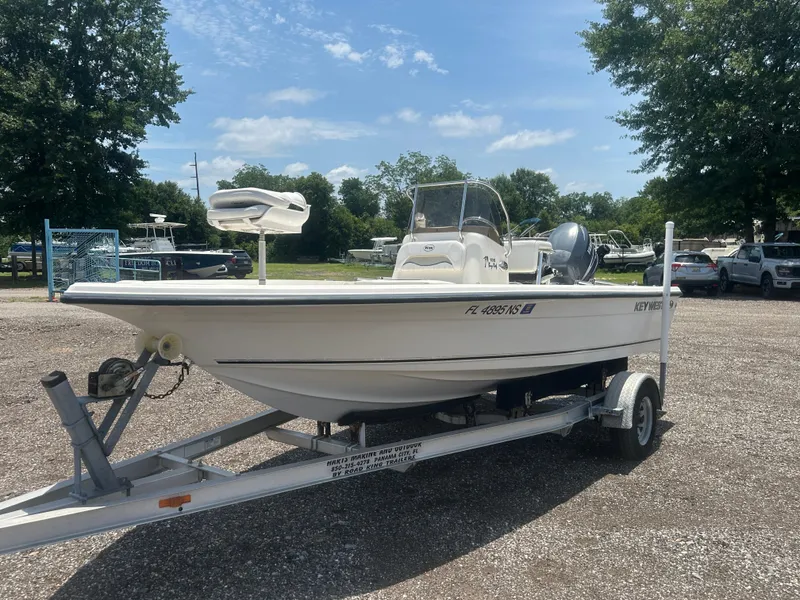 Slide: The Image of 2008 Key West 186 Bay Reef boat on trailer in outdoor setting. - 1